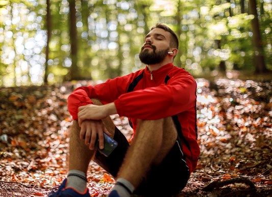 Person relaxing in a forest
