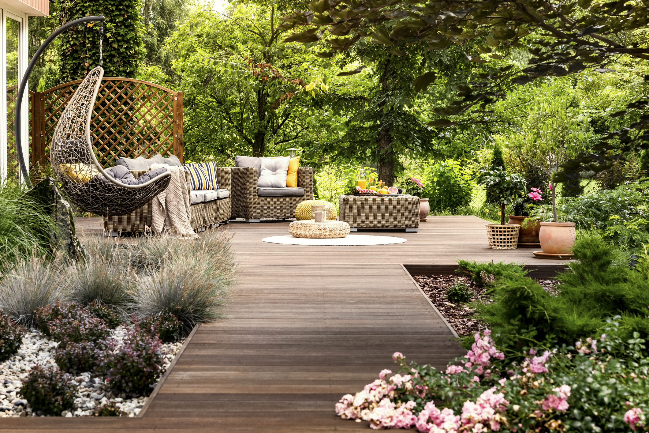 Back porch area with furniture and flowers