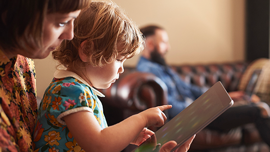 Mom and baby looking at a tablet