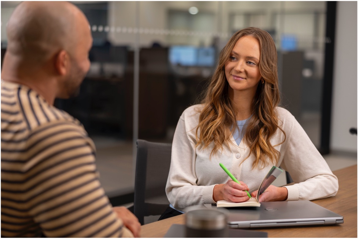 Woman taking notes in a meeting